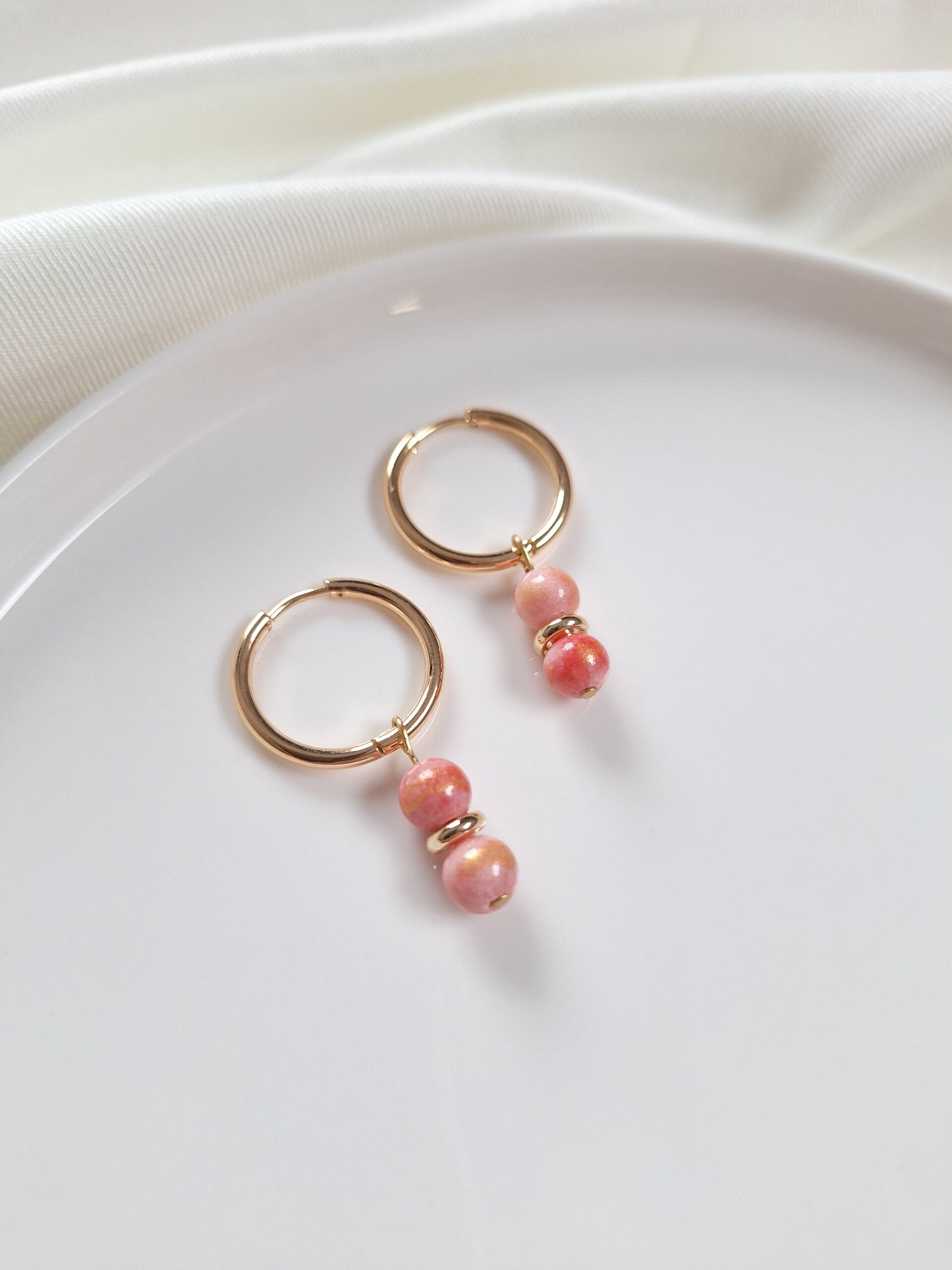 RVS oorbellen goudkleurig, roze/goud