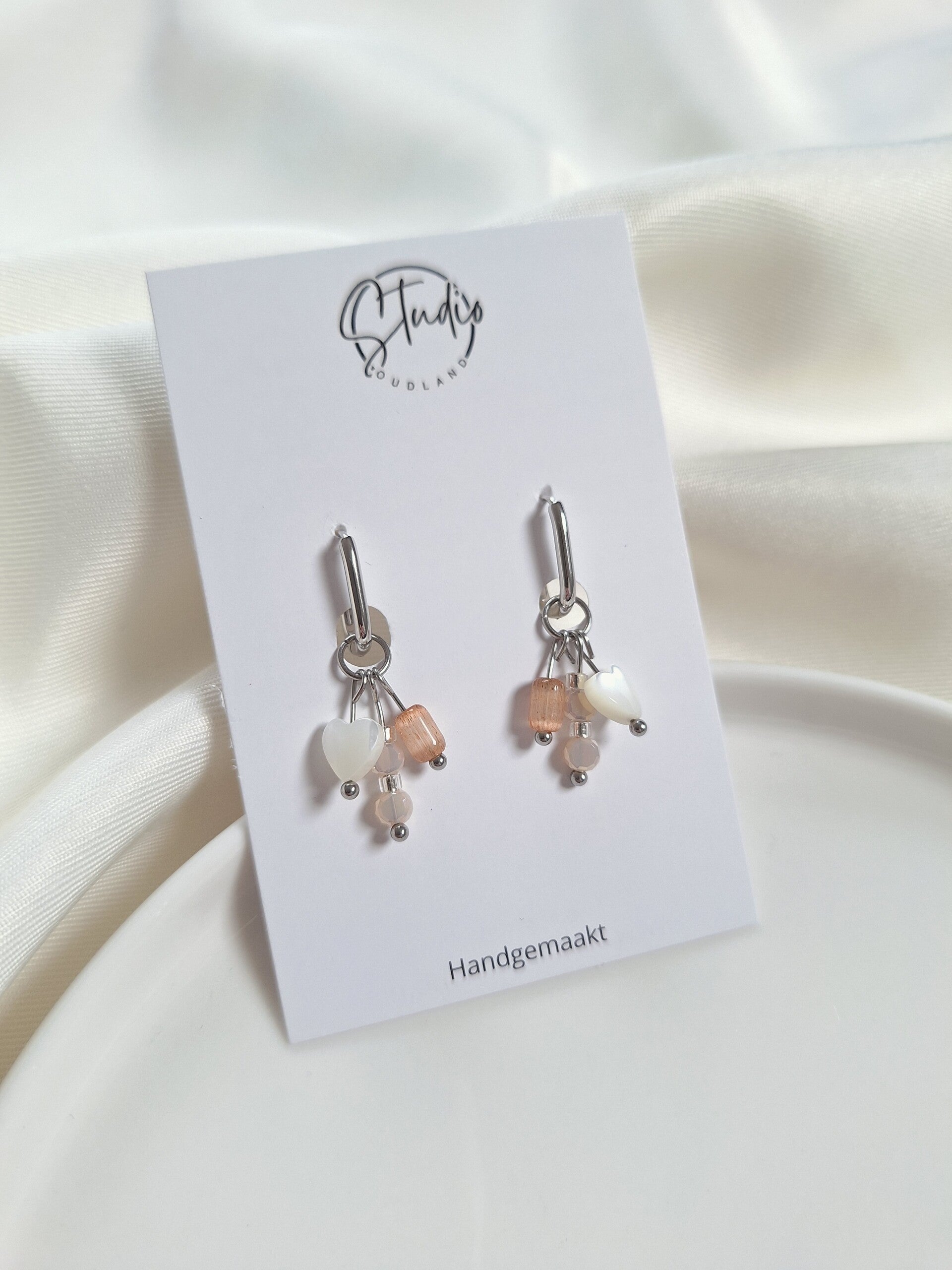 RVS oorbellen met bedels zilverkleurig