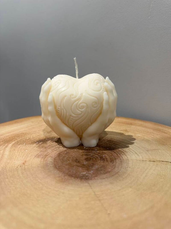 HANDS HOLDING HEART candle