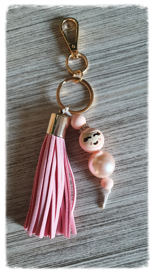 Popje van geluk - koraal - Flosh roze