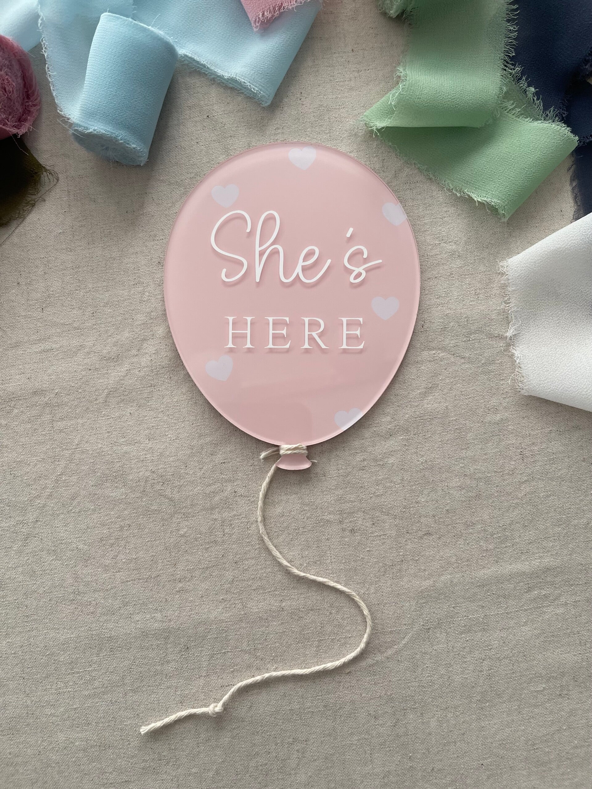 "She's here" balloon plaque with hearts