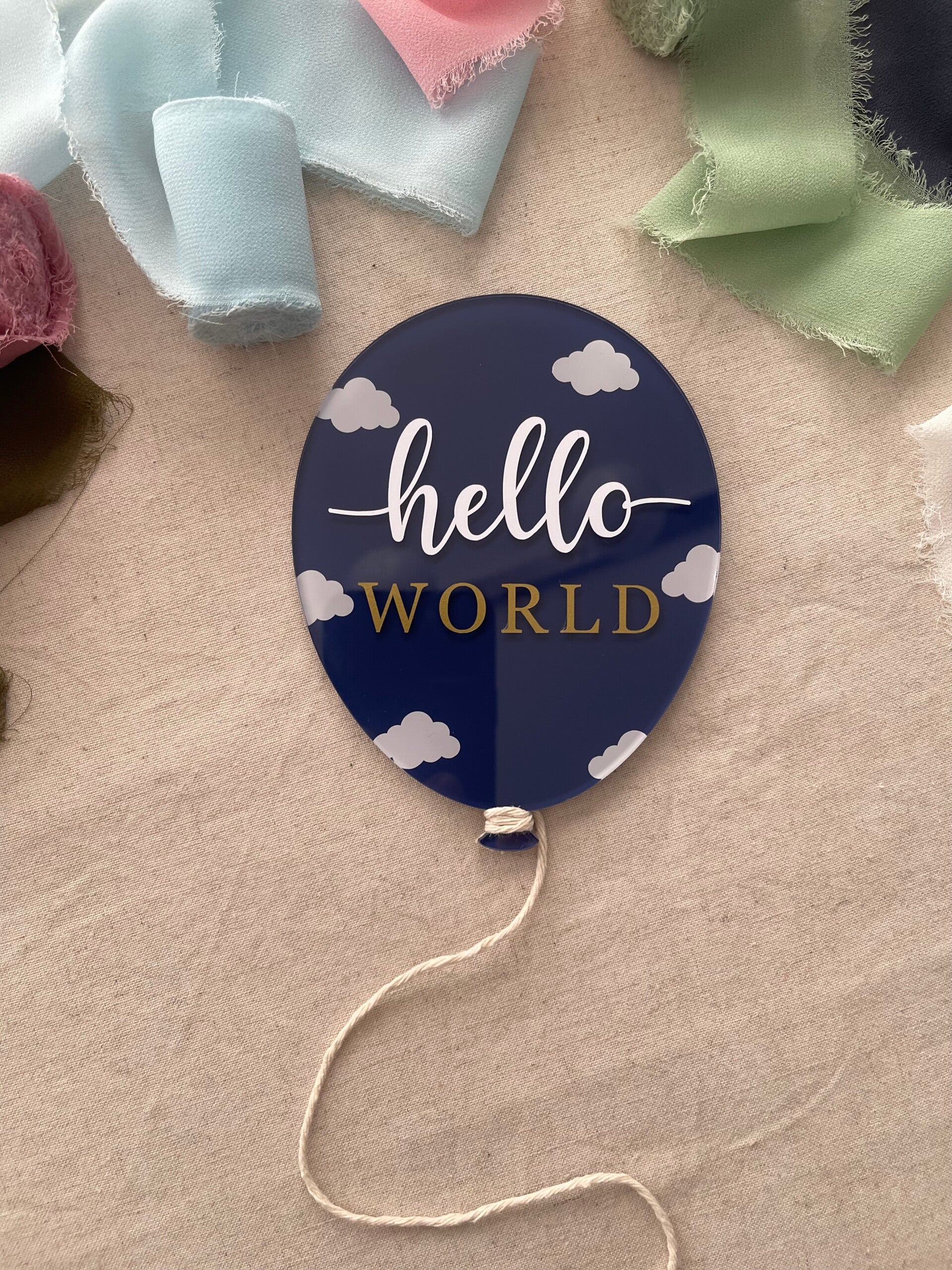 "Hello world" balloon plaque with clouds