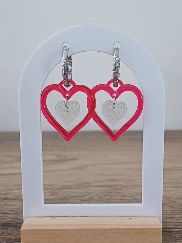 Double coeur rouge et paillettes blanches