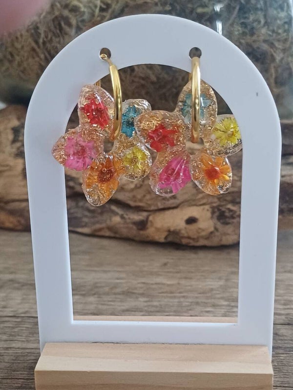 Grandes hibiscus avec fleurs séchées et feuilles d'or