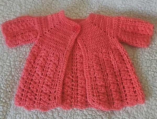 Petite veste corail 6/9 mois