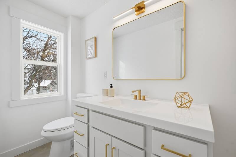 Luxury bathroom remodel in Orono Minnesota featuring a custom walk-in shower, modern vanity, premium tile finishes, and high-end fixtures by Presidential Construction Co.