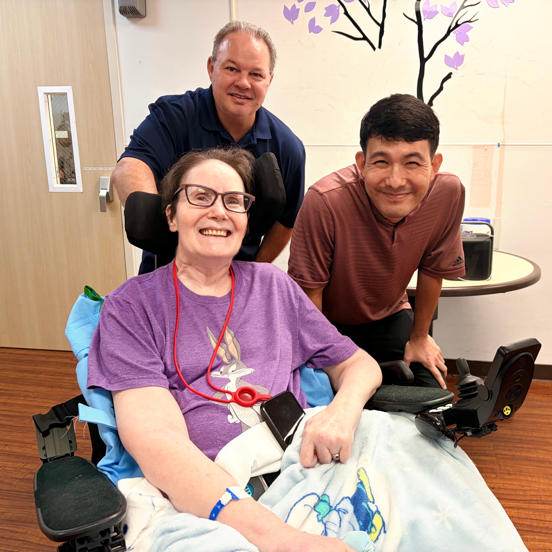 Ellen gets measured for a new wheelchair