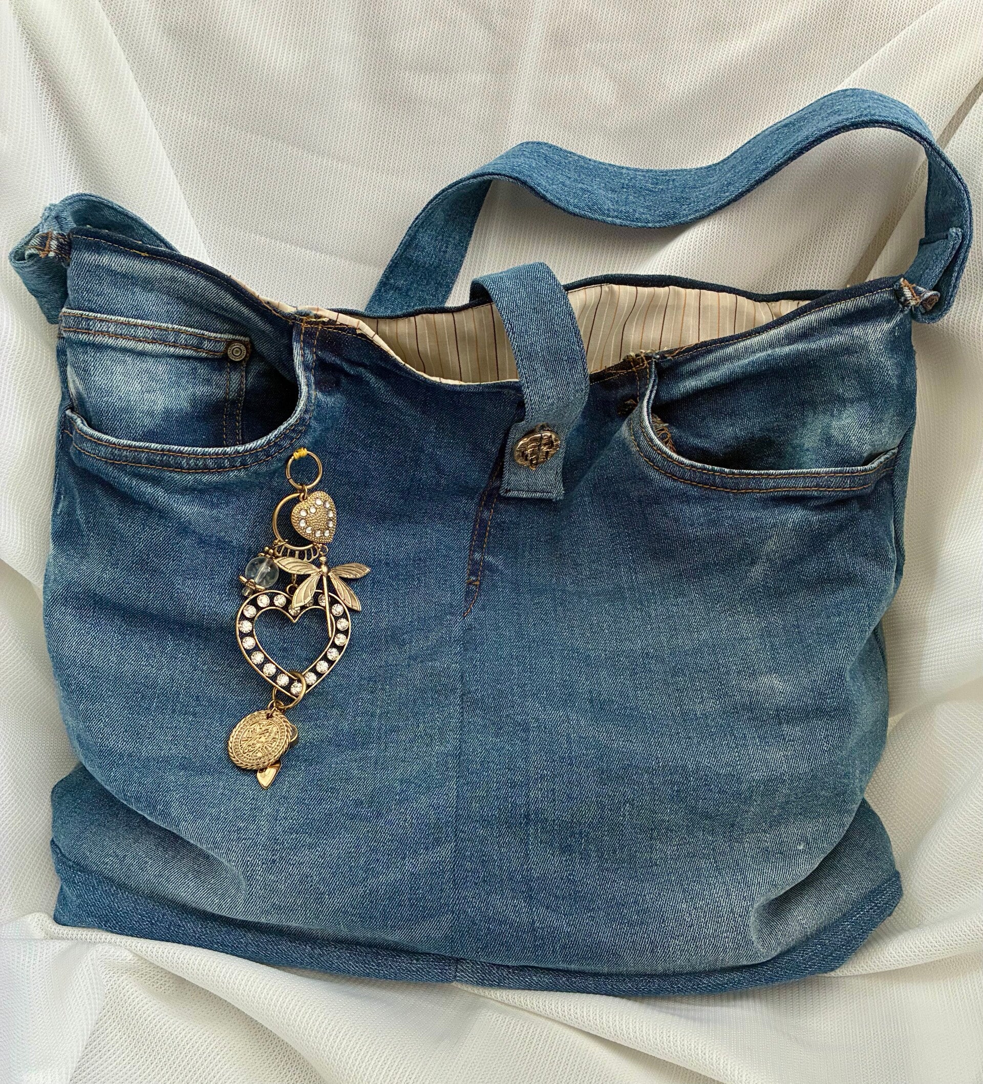 Upcycled, handmade denim handbag with charm