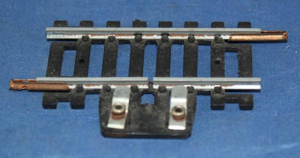 Lima H0 contact rail 55,5 mm.