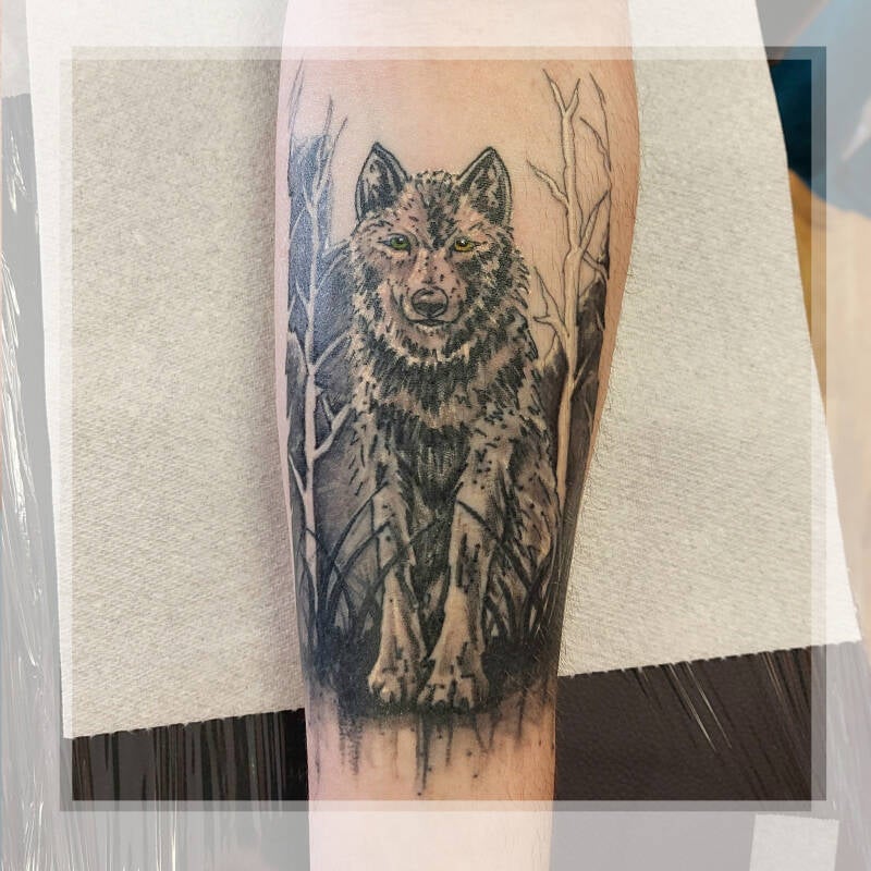 wolf forest arm tattoo