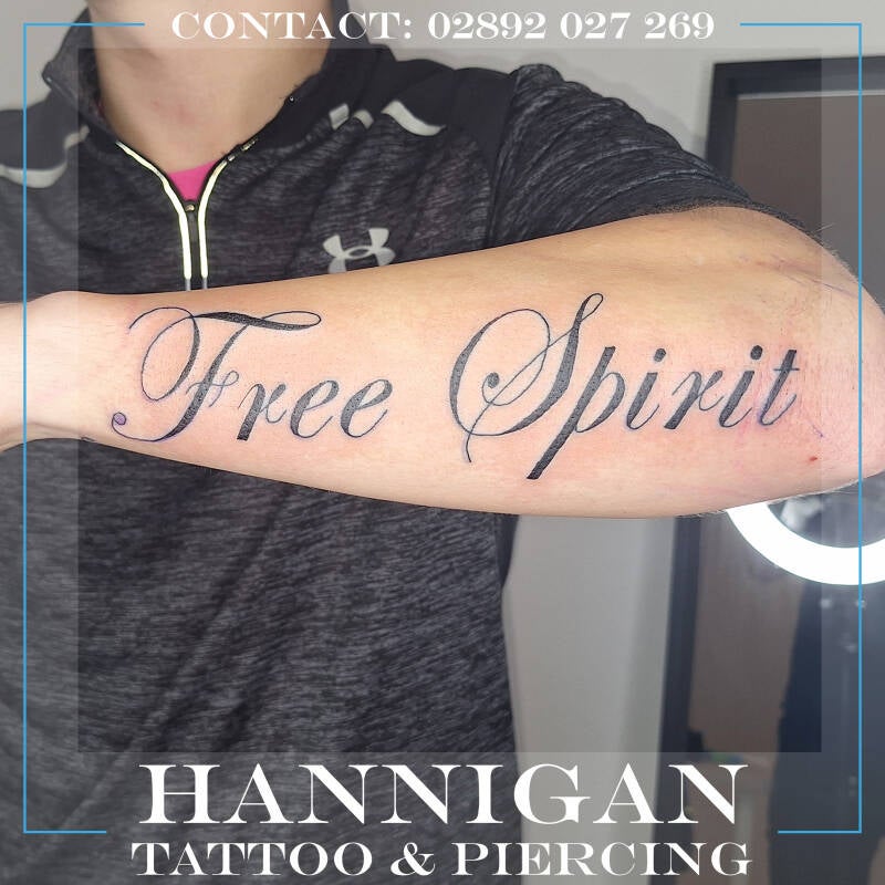 large writing tattoo