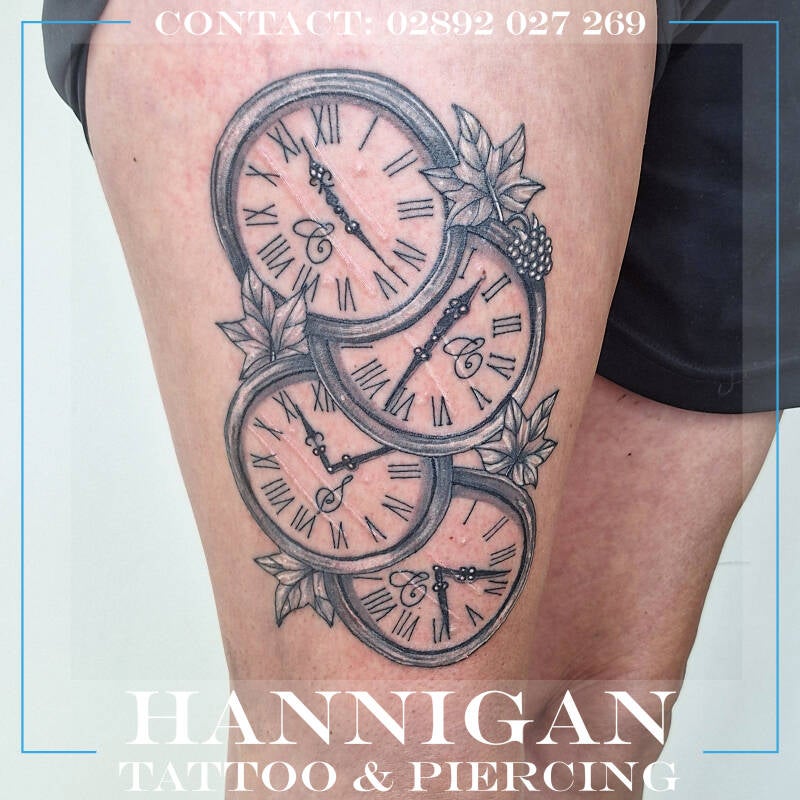 clocks thigh tattoo