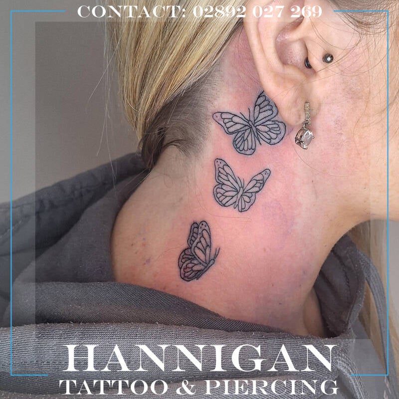 three butterfly neck tattoo