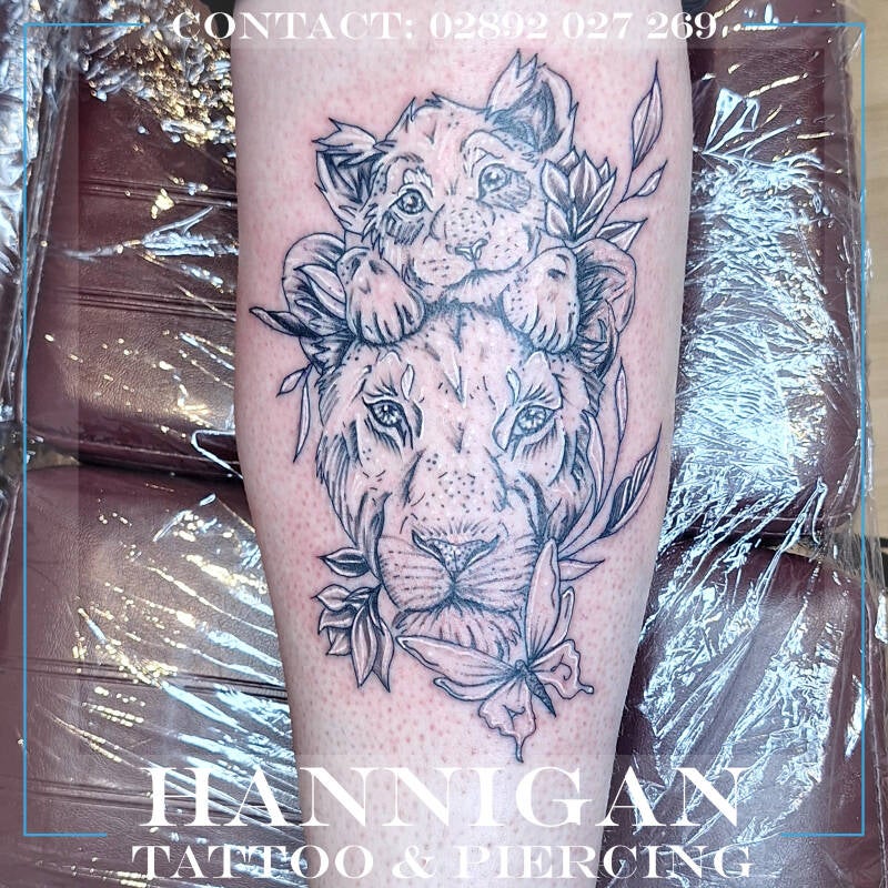 Mother and child lion tattoo
