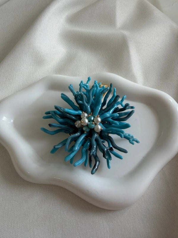 Copribottone corallo