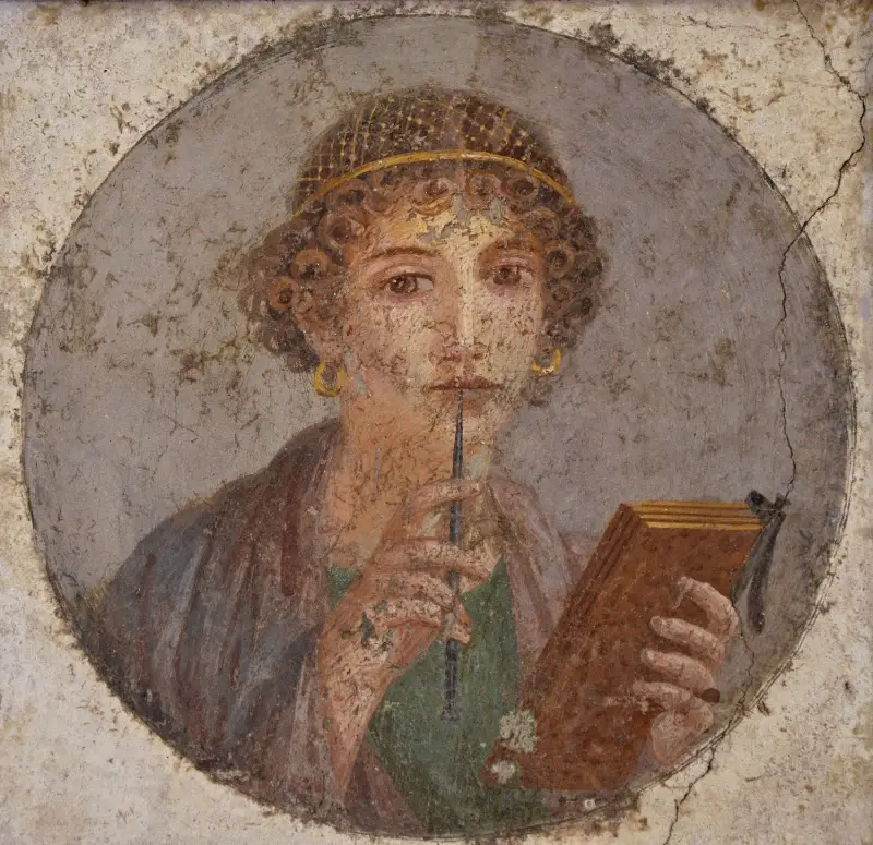 Fresque à Pompéi d'une femme dite Sappho tenant des instruments d'écriture