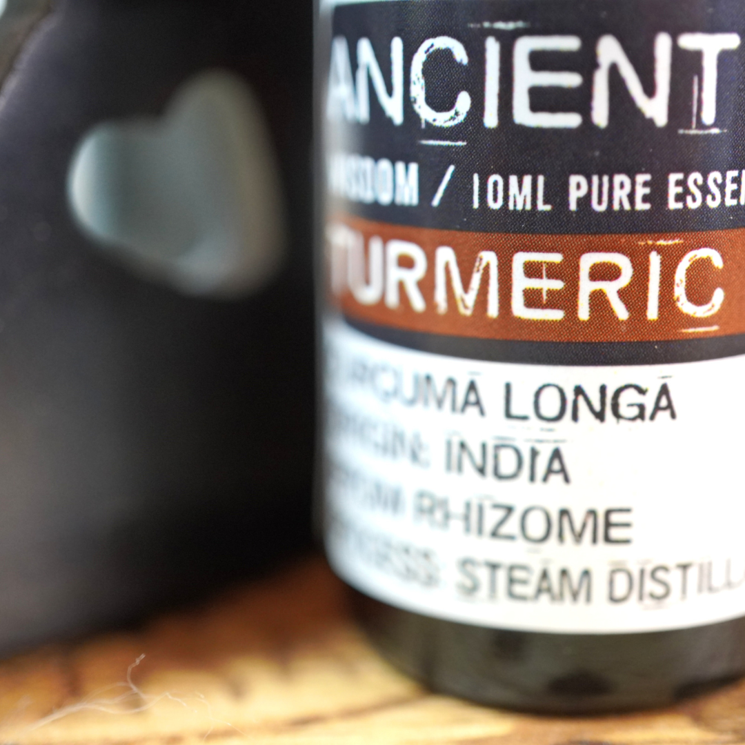 100% Kurkuma essentiële olie van Ancient Wisdom, 10 ml in een oudroze aroma diffuser met de tekst Love, home sweet home, erop.