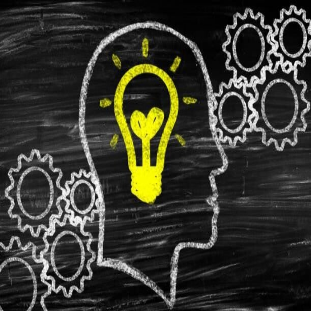 Silhouettenprofil eines Kopfes mit einer bunten Glühbirne in Form eines Gehirns im Inneren, symbolisiert Optimismus , Kontext Blog Jenseitskontakte Jana Lorenz.