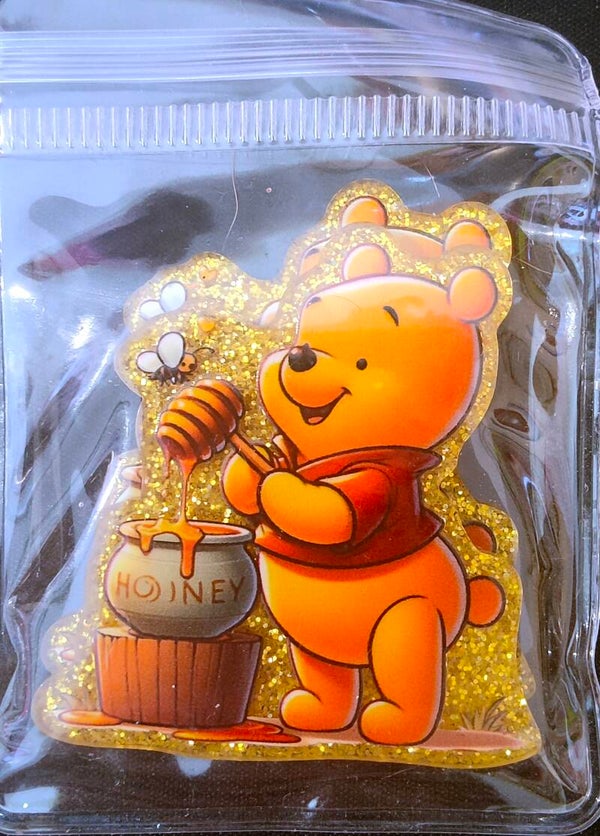 Winnie with honey and bee