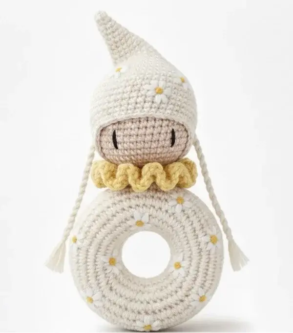 Crochet Pattern for a ring teether with a pointed beanie on the head