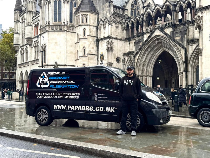 Simon Cobb beside the black P.A.P.A. van in the United Kingdom