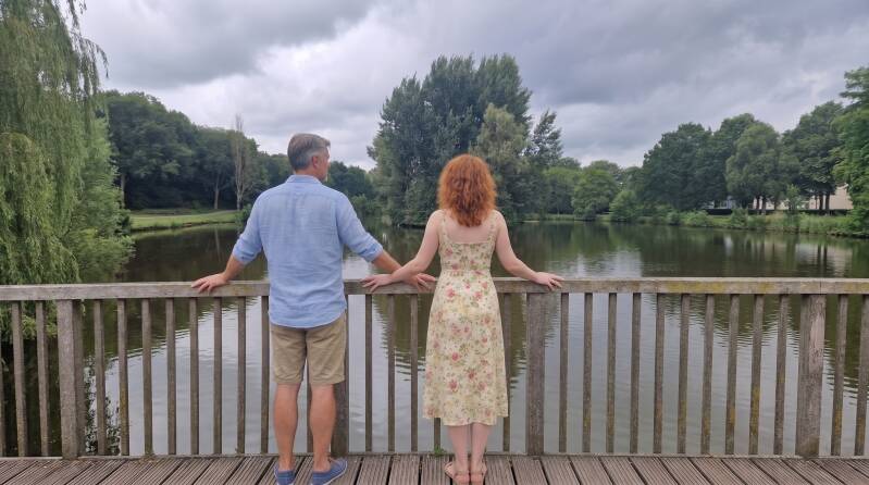 man_and_woman_at_railing_202607051229-standard.jpg