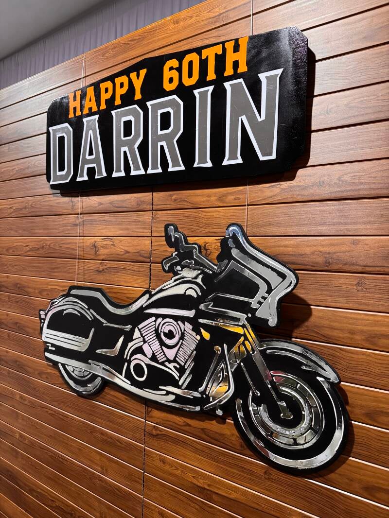 Heritage Wall backdrop with motorcycle and Happy 60th Birthday signage at Eat Street Northshore, Brisbane.
