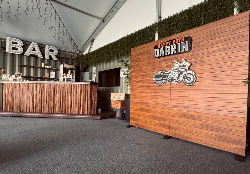 Heritage Wall backdrop with motorcycle and Happy 60th Birthday signage at Eat Street Northshore, Brisbane.
