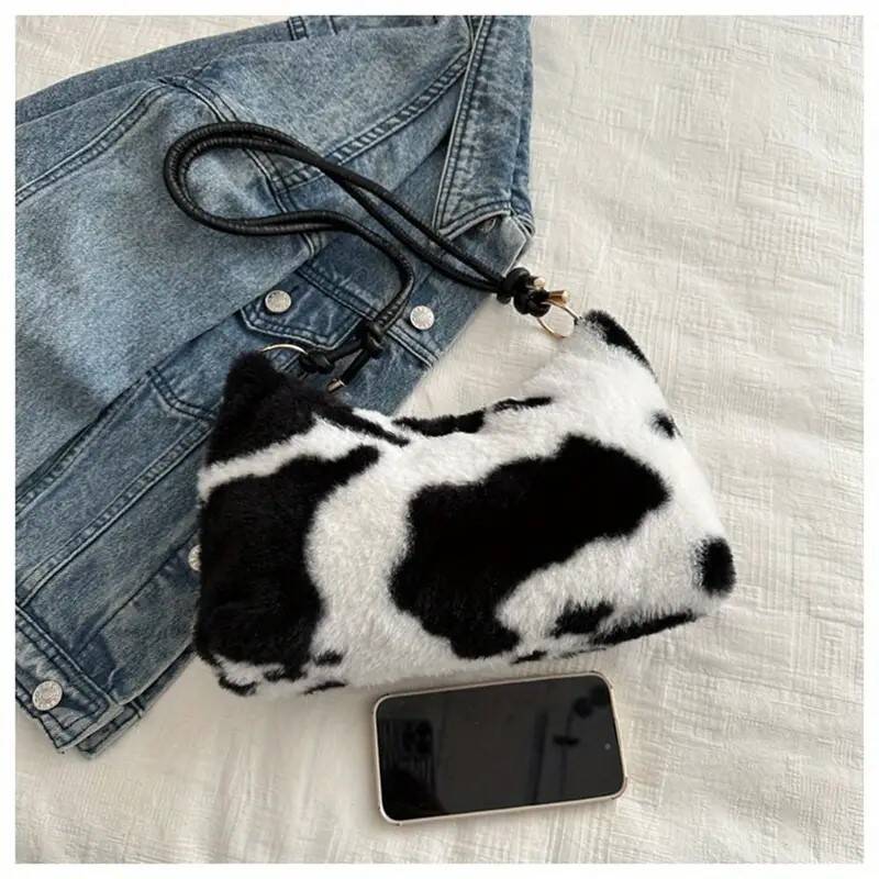 nepbonte geschoren tas in koeienprin met kort en lang hengsel