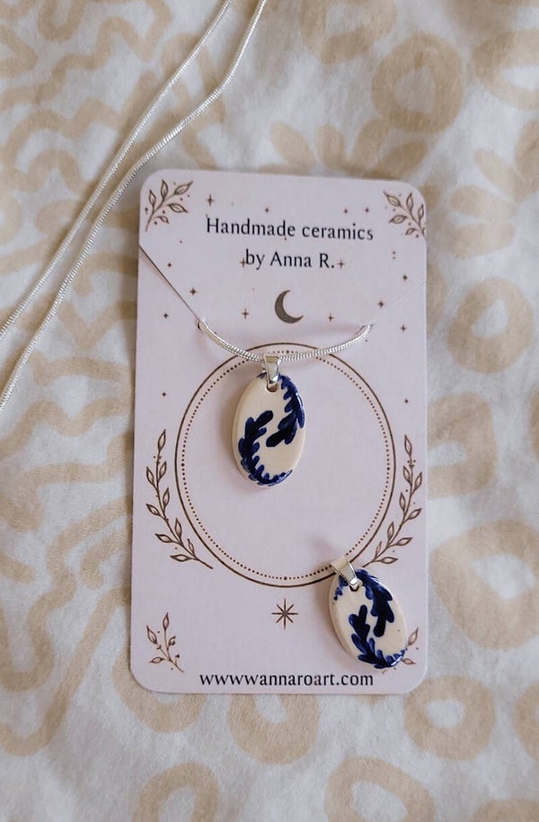 Botanical motif ceramic pendant on silver chain