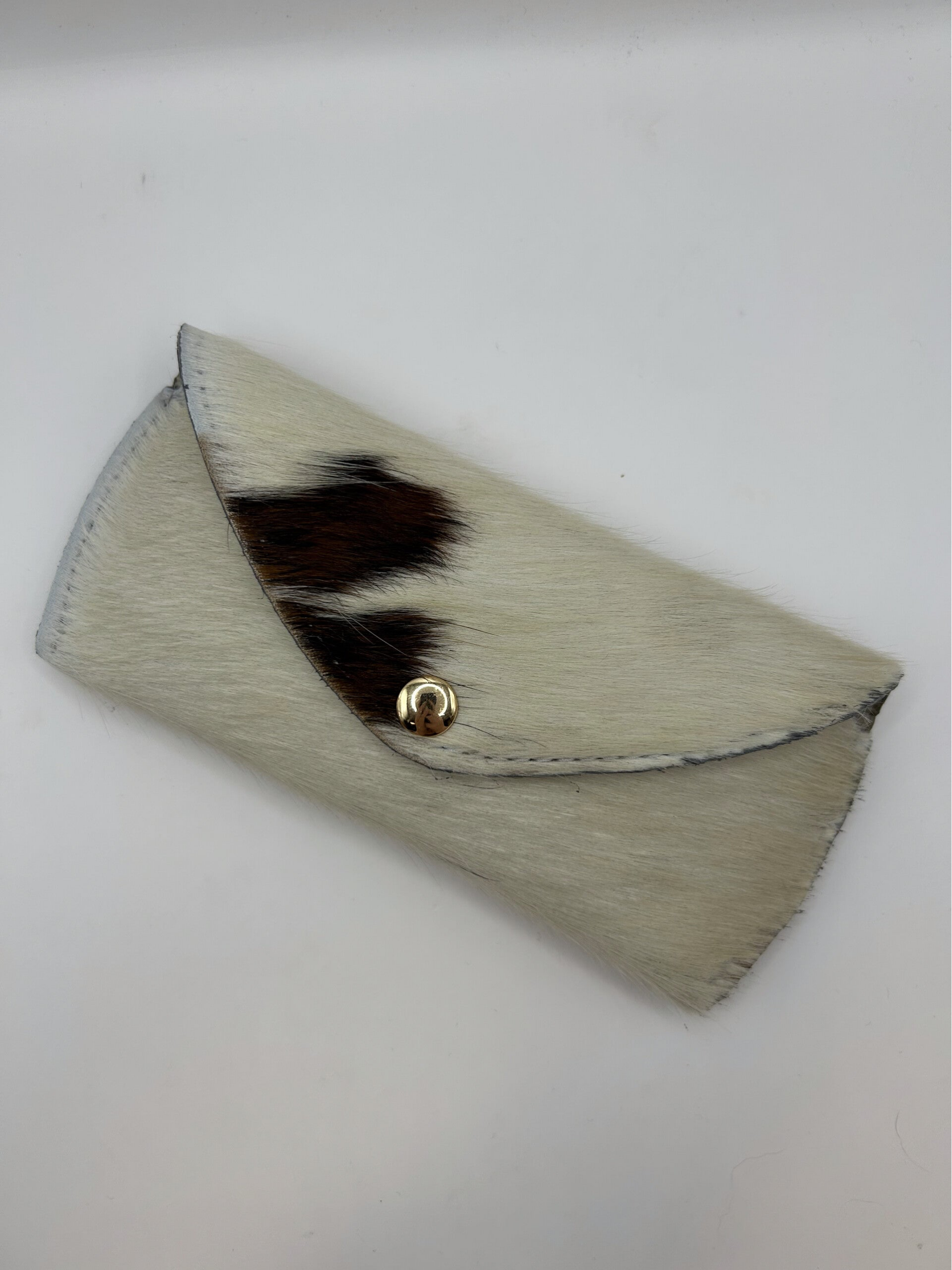 Brillenhoes bruin met wit koeienhuid