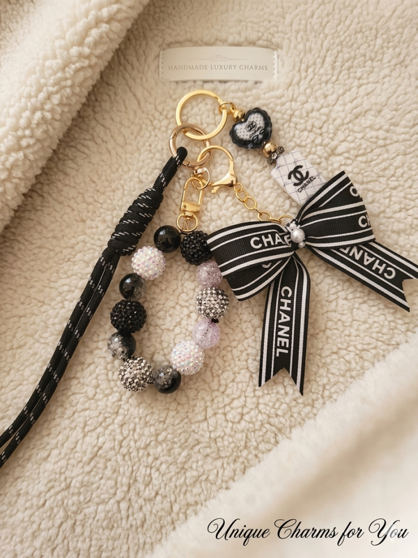 Zwart gouden bagcharm