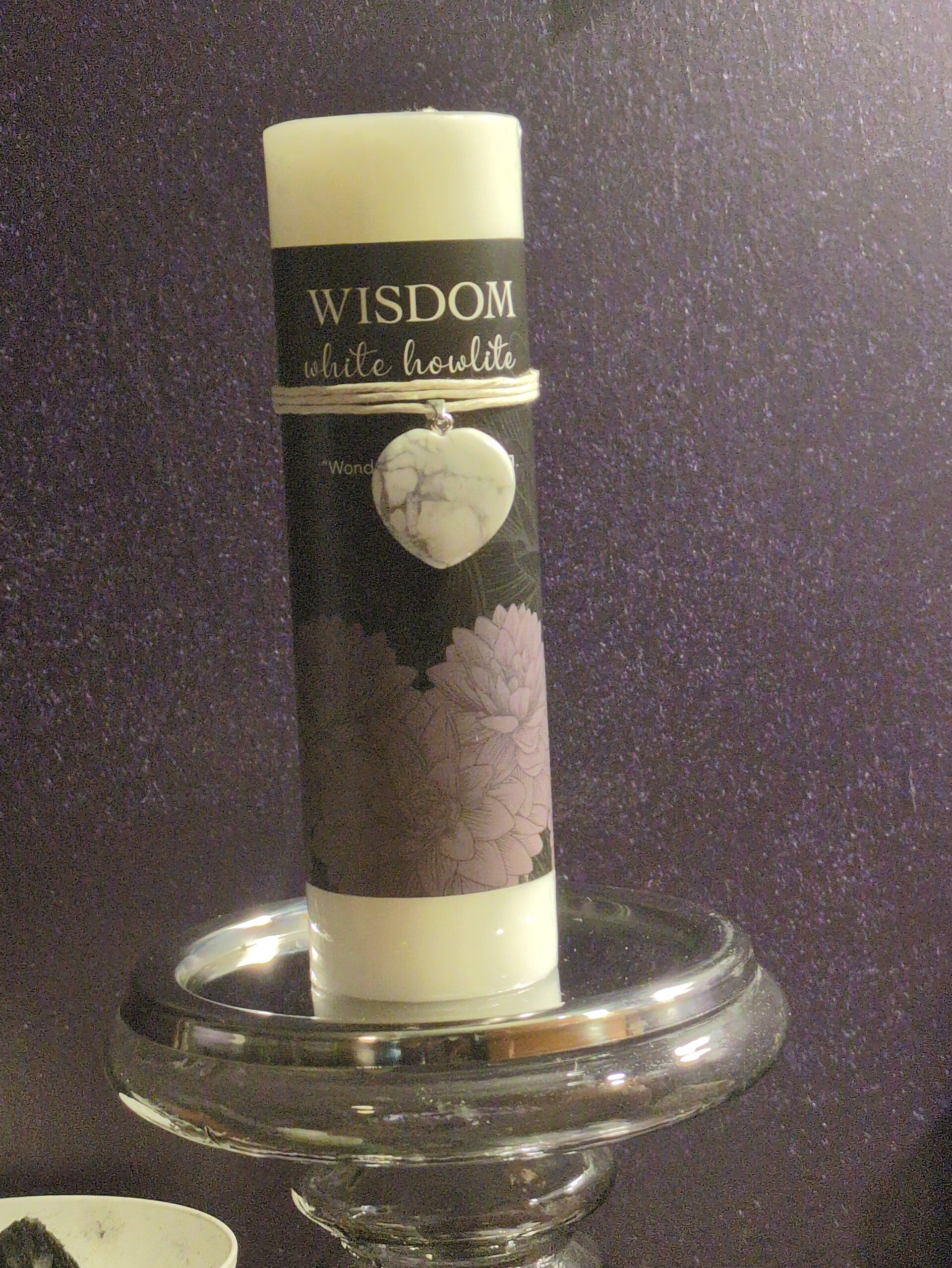 The item is a Wisdom White Howlite Heart Pendant Candle, a 6-inch pillar candle that includes a detachable white howlite crystal heart pendant