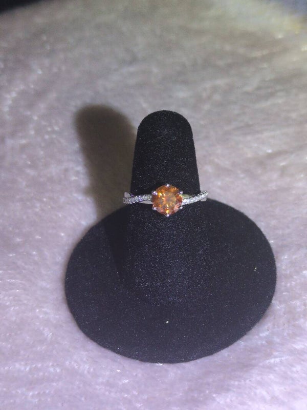 This size 7 ring features a brilliant-cut, fiery orange gemstone moissanite —set in a classic six-prong solitaire mounting.