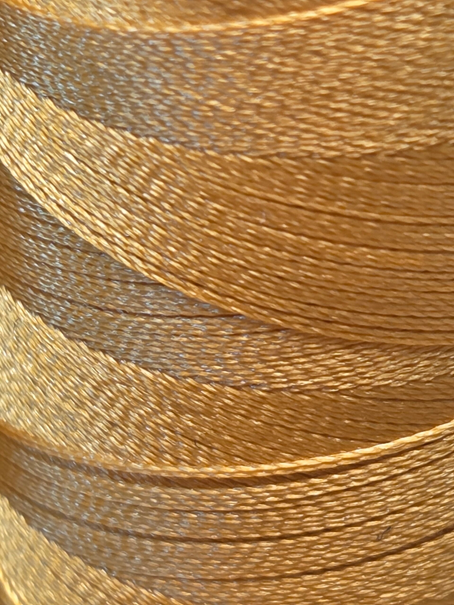 Close-up of premium embroidery thread at AU79 STUDIO