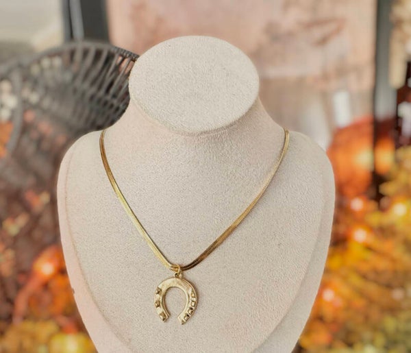 Large gold horseshoe herringbone necklace