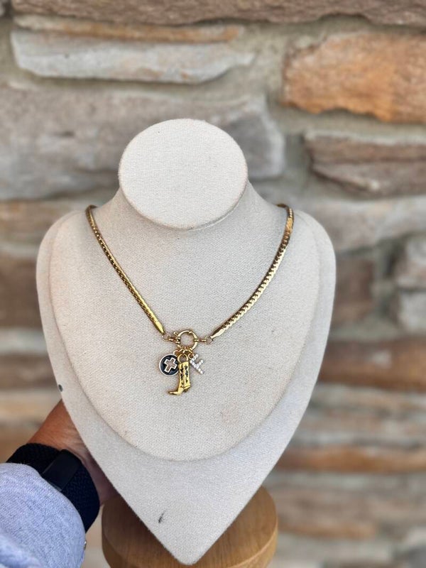 Clasp boot and cross necklace