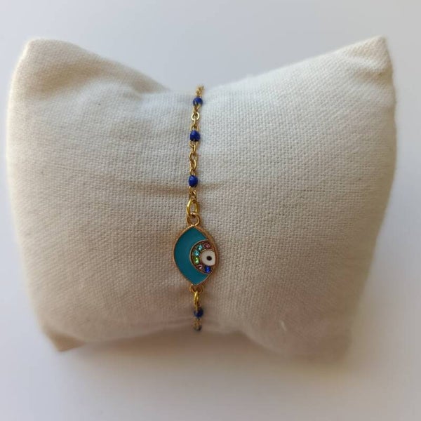 PE-BRCH-REF11002-(13.00€)-Un Bracelet Chaine Doré Perle Bleu -  Breloque centrale Yeux Cyan-  Strass