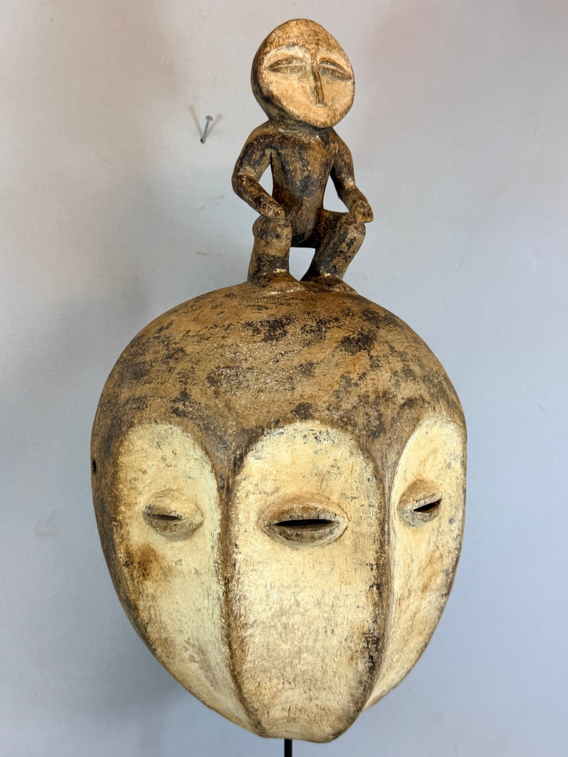 260265 - Old African 4 face mask from the Lega Bwami with statue on top Congo.