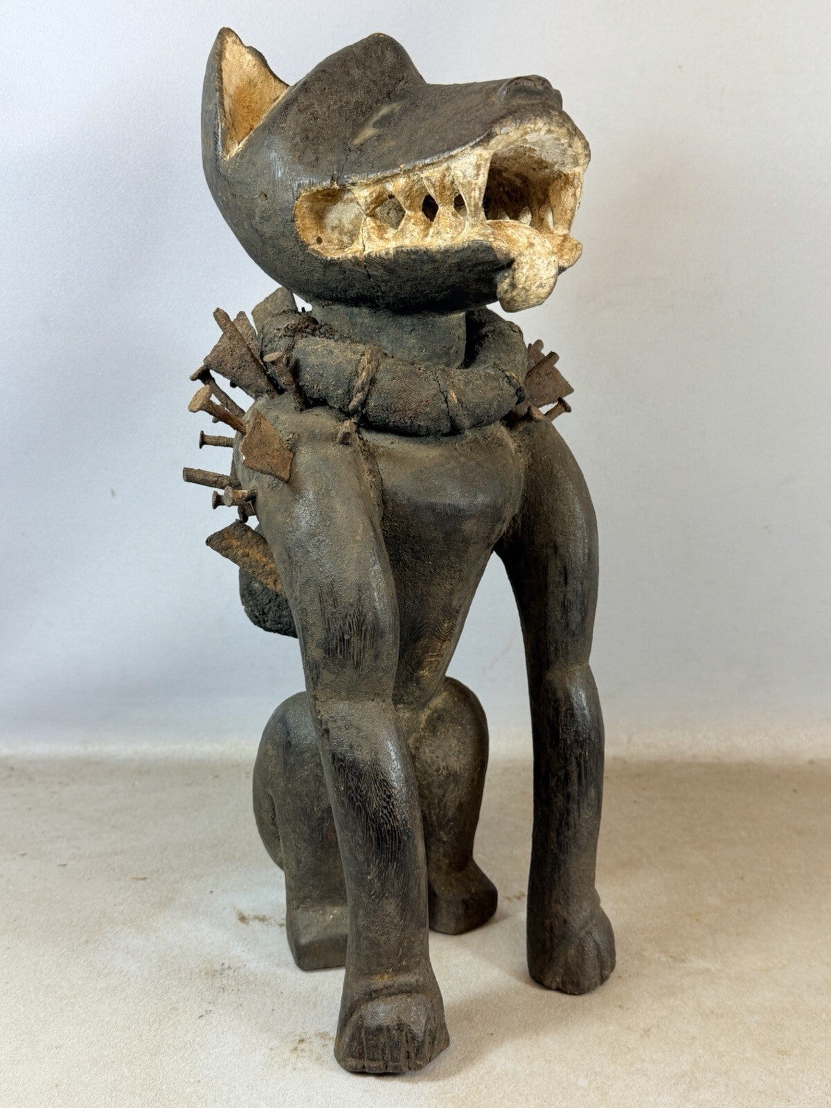 260502 - African Fetisch Bakongo Nkisi Nkondi sitting dog - glass eyes - Congo.