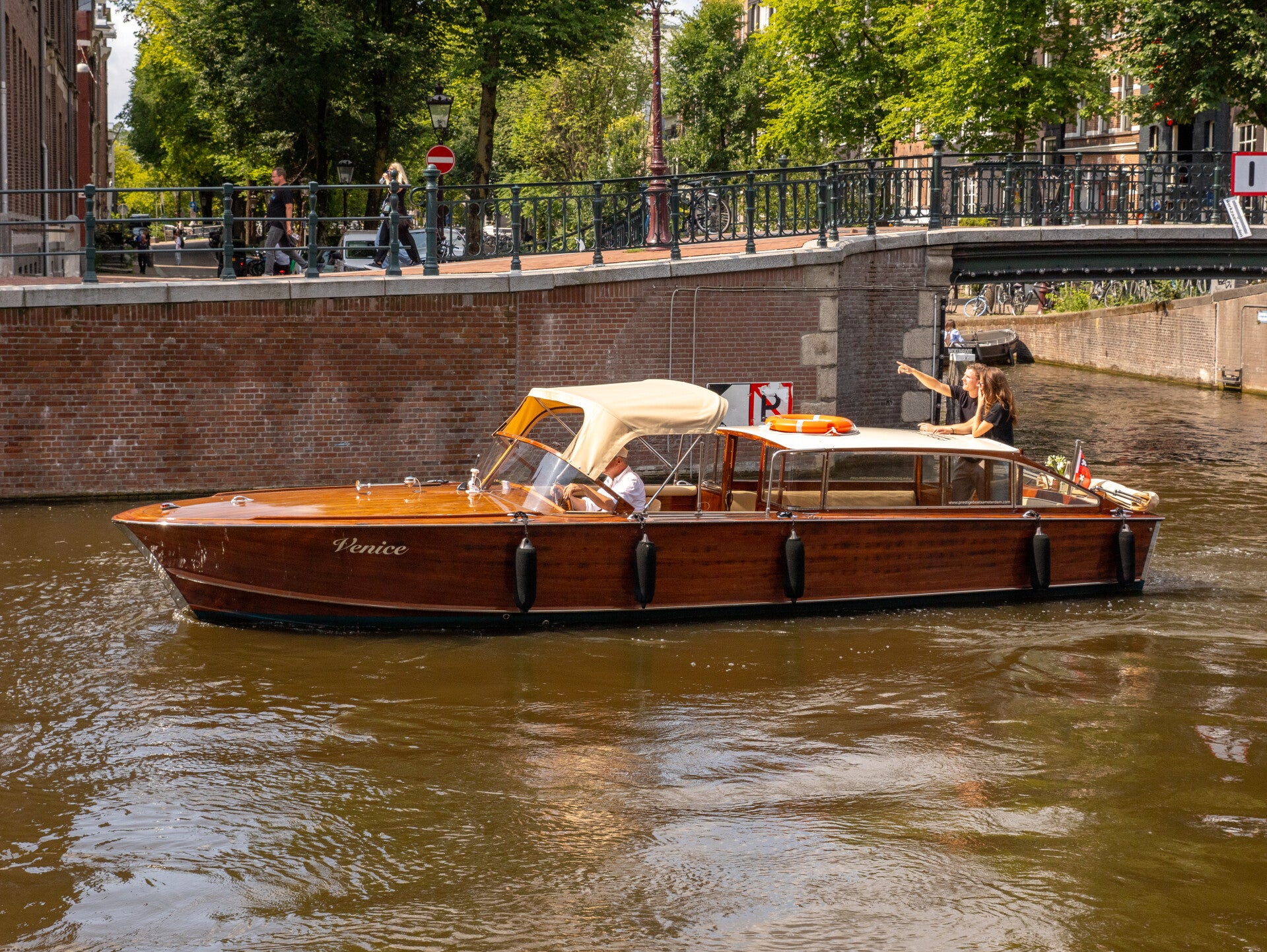 Private canal cruise in Amsterdam aboard our luxury Italian wooden boat, heated and covered