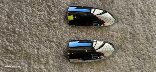 61-62 Headlight trim ring tabs (pair) NOS Blemish