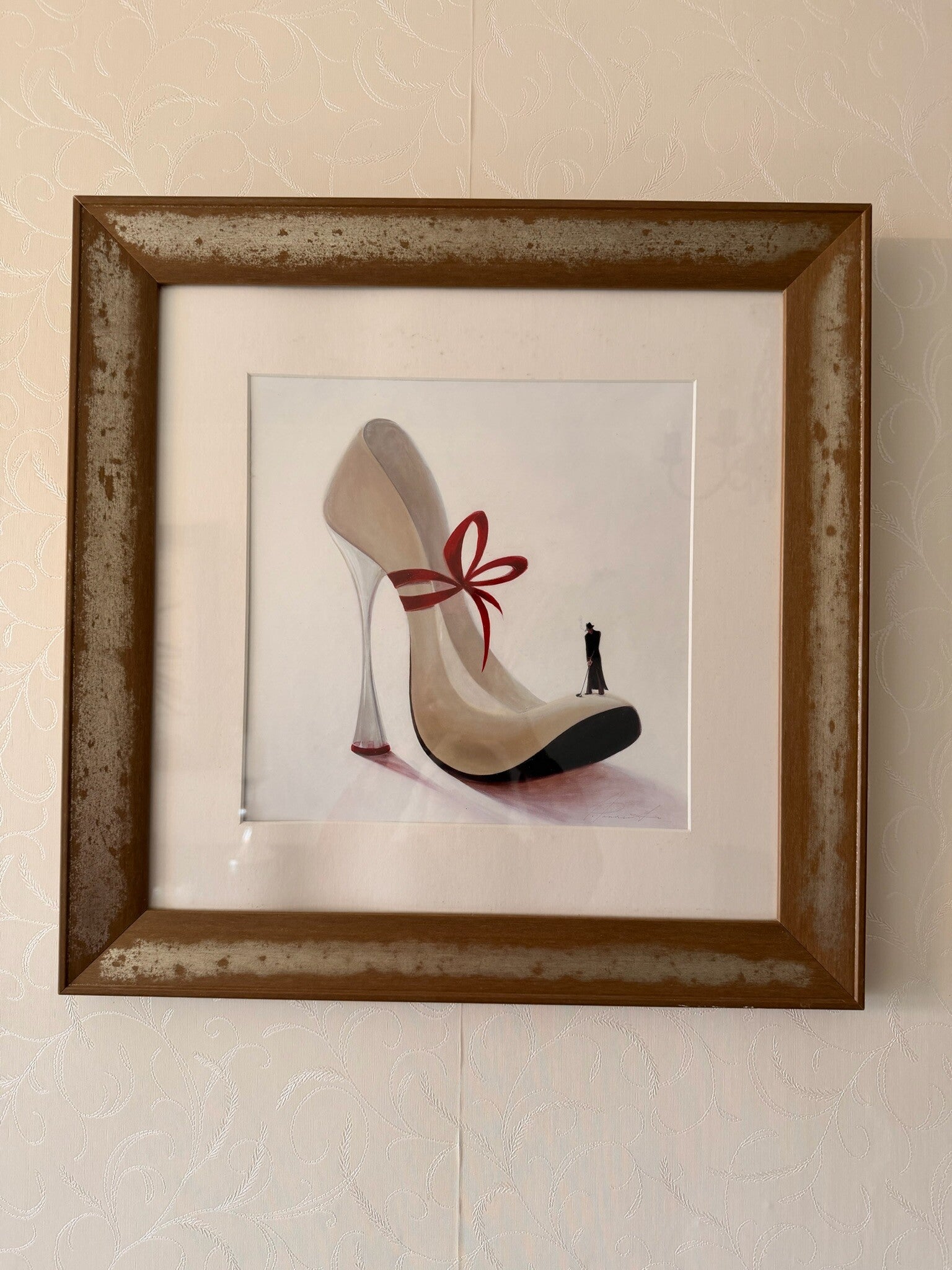 Framed heel shoe and golfer print