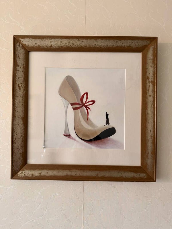 Framed heel shoe and golfer print