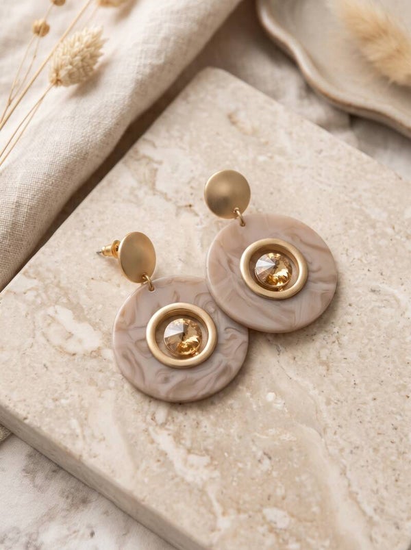 Gouden Oorbellen met Marmer-look en Amber Kristal