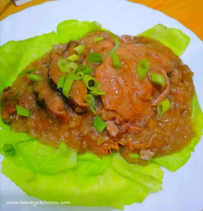 Lemongrass Chicken and Mushroom Sticky Rice (Lo Mai Gai) on top of steamed green cabbage leaves and sprinkled with leeks. Recipe and photo by Amrey Boquiren for Amrey’s Kitchen™.