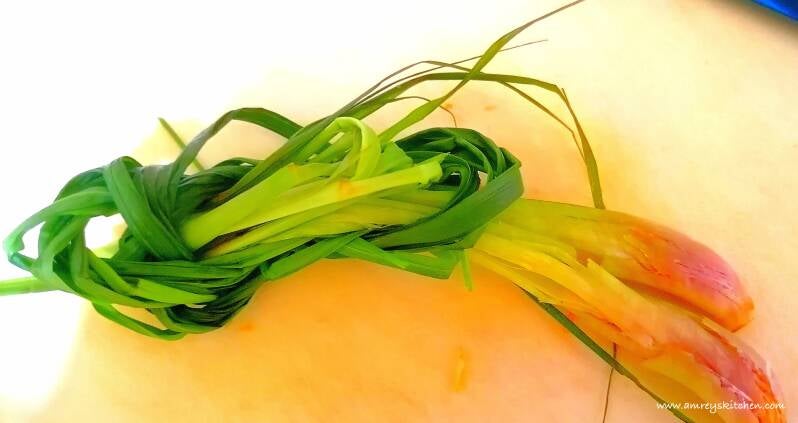 Lemongrass stalks, tied and pounded. Photo by Amrey Boquiren for Amrey’s Kitchen™.