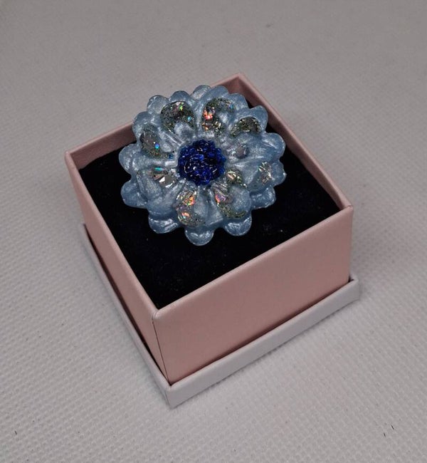 Bloem broche blauw