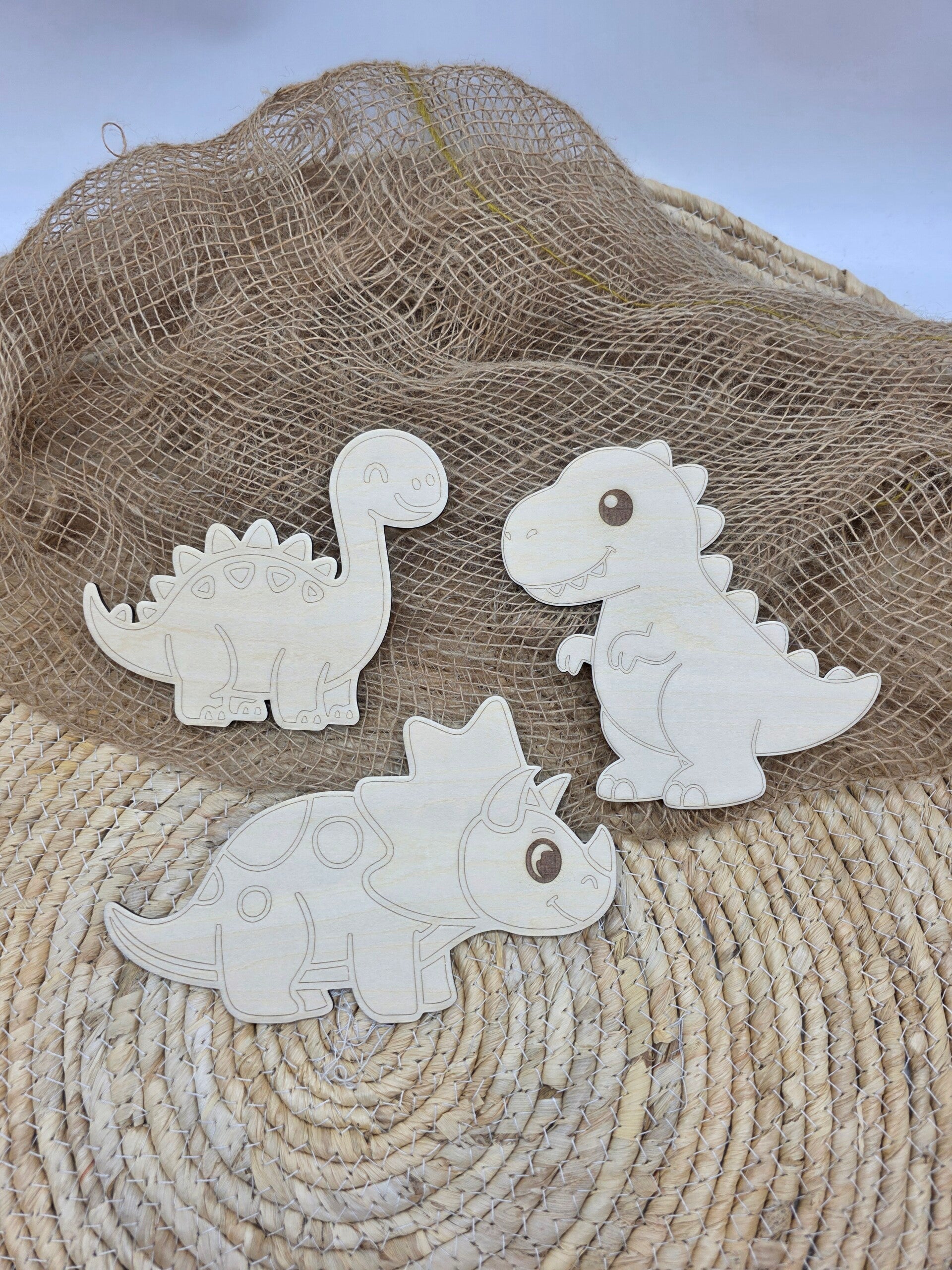 drie houten dino's