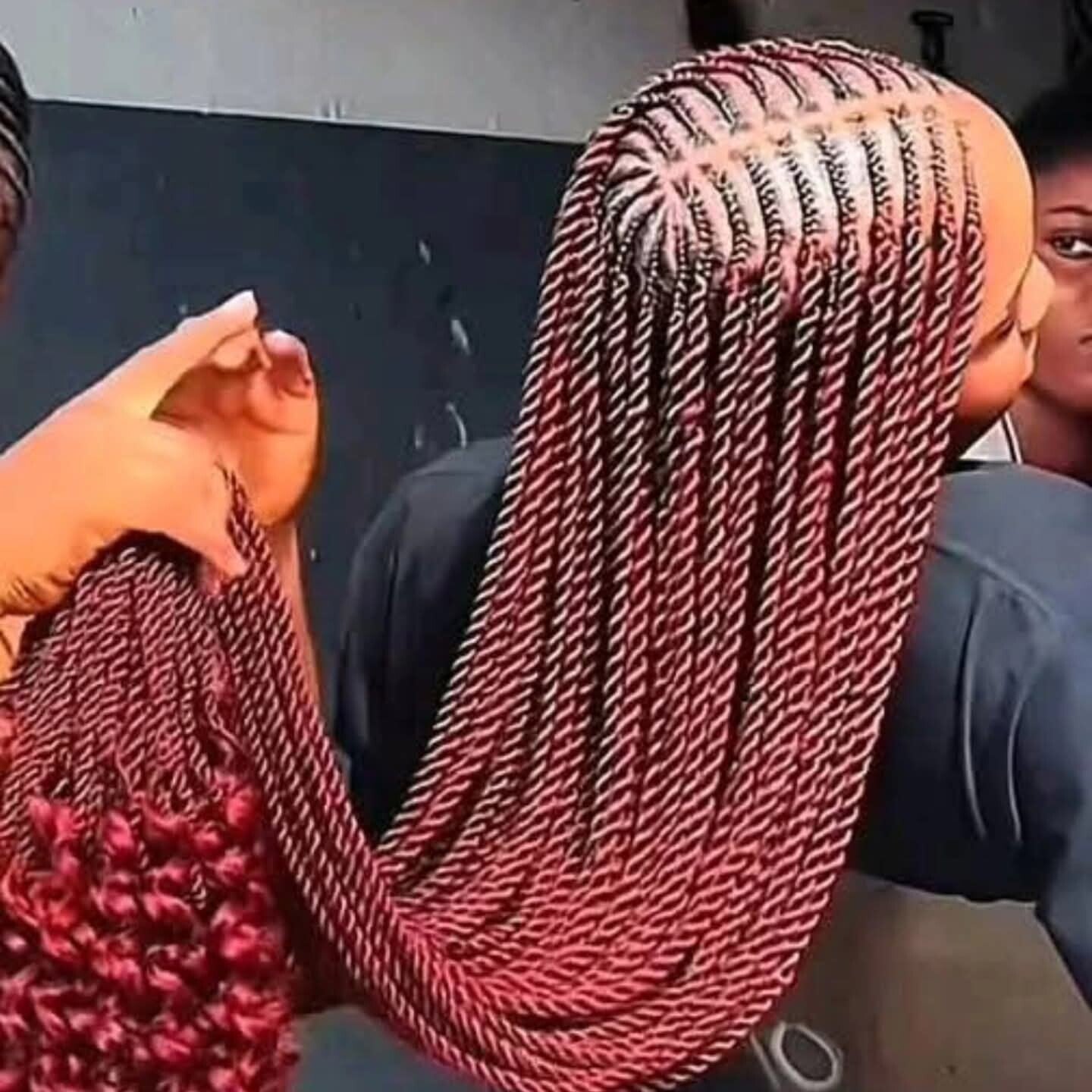 Twisted hair with Ghana weaving at the middle end with curls